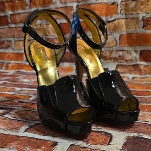 Report Signature Glossy Black Peep-Toe Heels